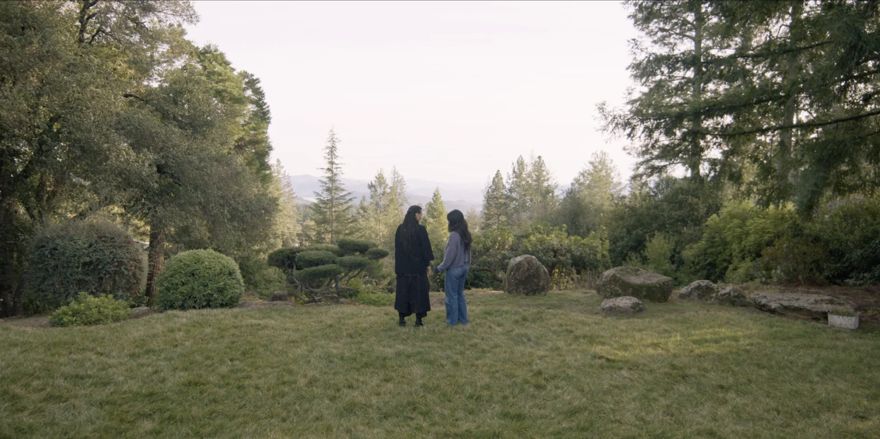 Albedo film still — two figures in the garden