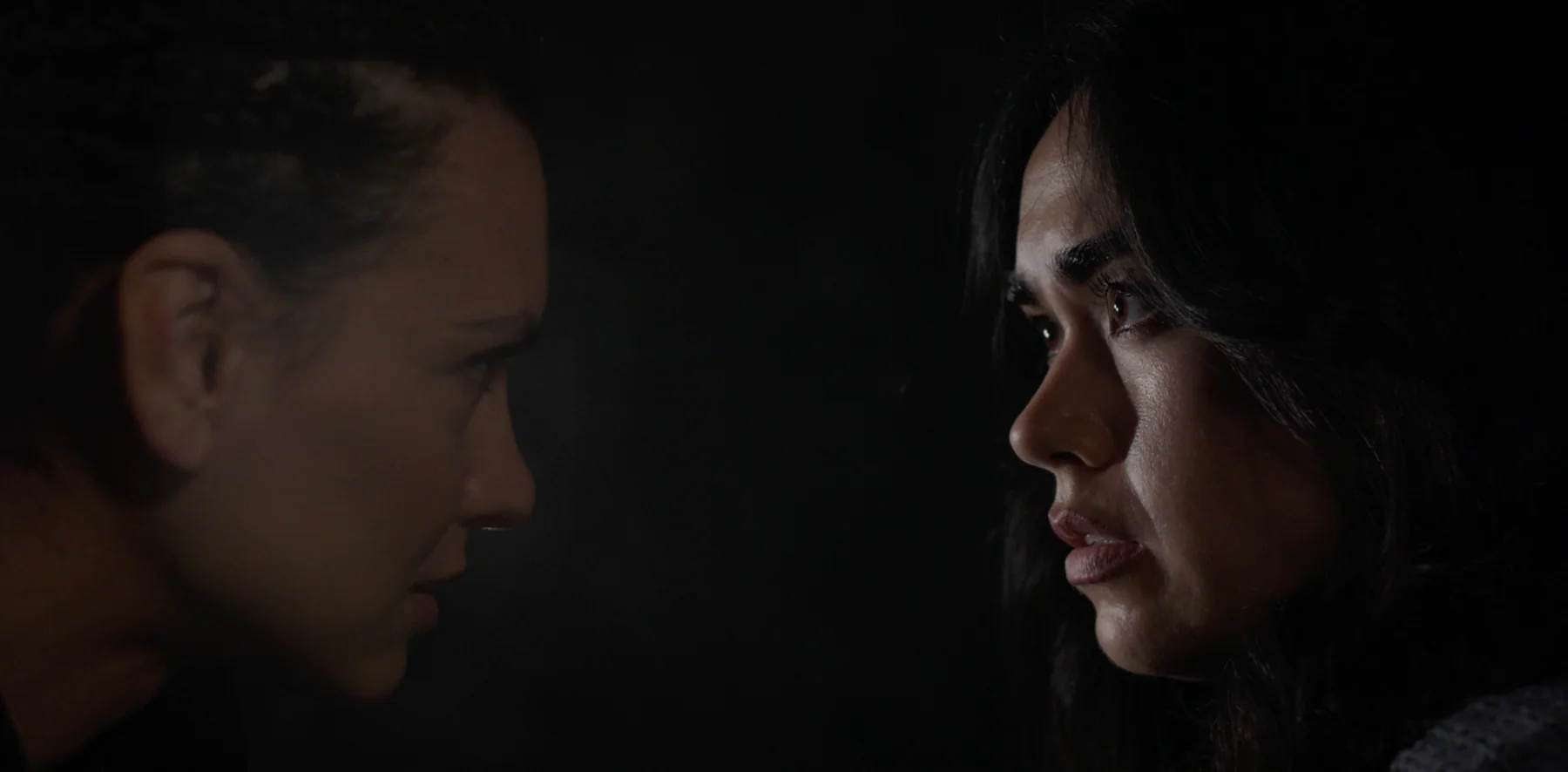Albedo film still — face to face in the dark