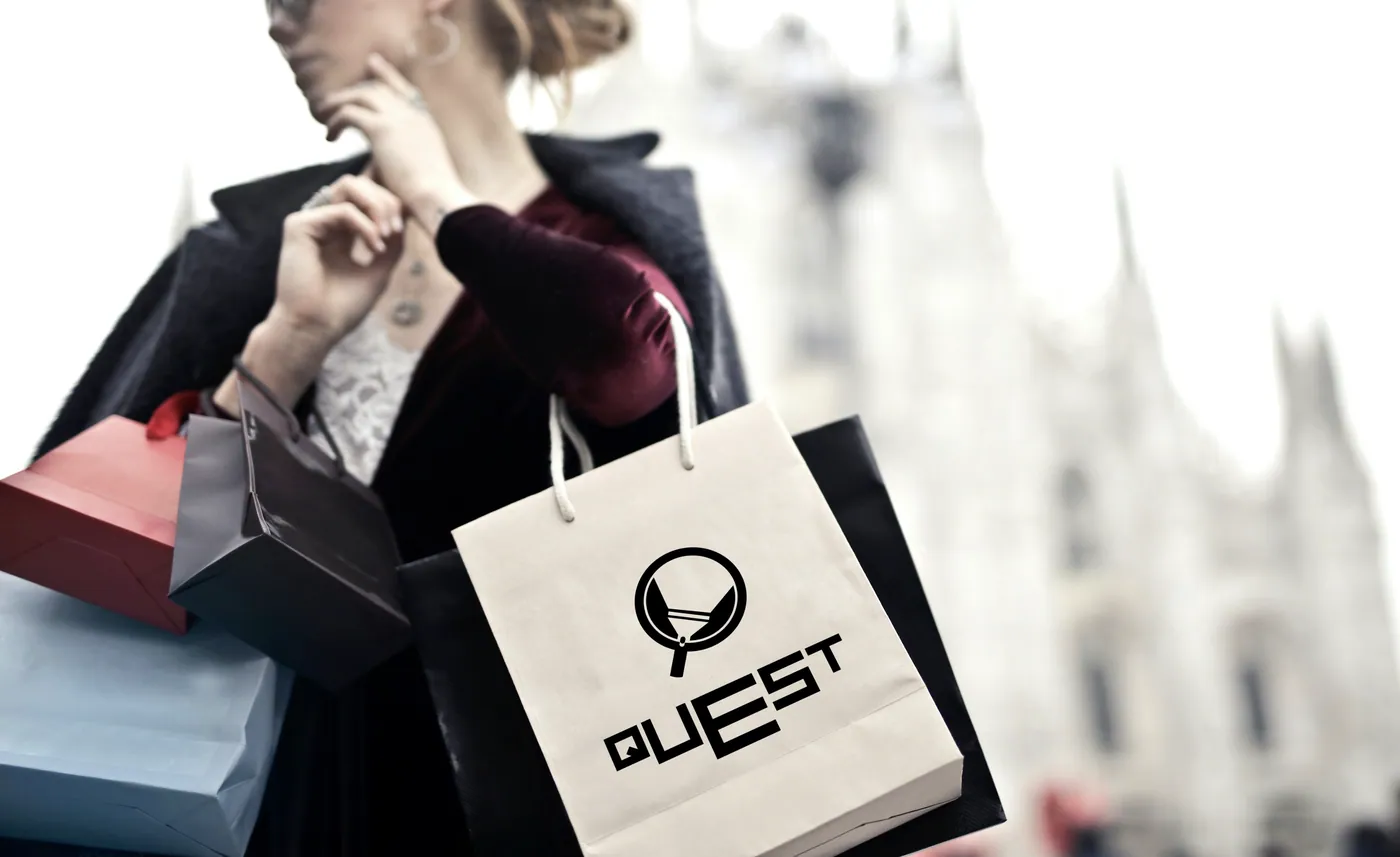 Quest branded retail carry bag on a city street